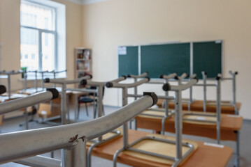 Interior of empty school classroom without students and teacher