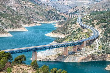 A view of the Rules Reservoir and the road A-44. Velez de Benaudalla, province of Granada,...