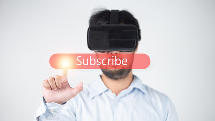 Man wearing virtual reality goggles with word Subscibe