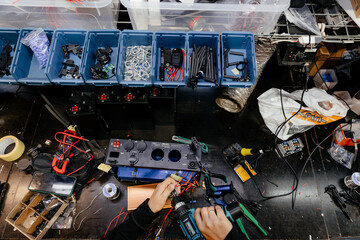 the process of manufacturing, mounting and soldering electrical elements for the creation of...
