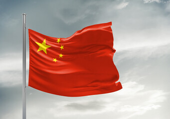 China national flag cloth fabric waving on beautiful sky Background.