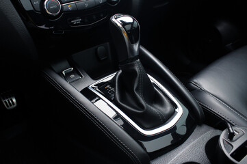 Plakat Close up of the automatic gearbox lever, black interior car, Automatic transmission gearshift stick. Closeup a manual shift of modern car gear shifter.