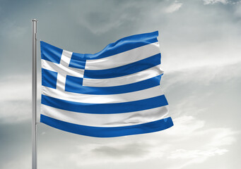 Greece national flag cloth fabric waving on beautiful sky Background.