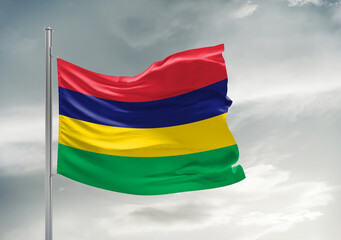 Mauritius national flag cloth fabric waving on beautiful sky Background.