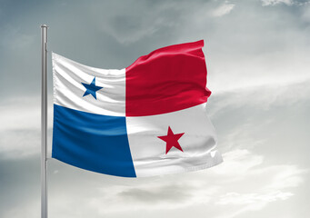 Panama national flag cloth fabric waving on beautiful sky Background.
