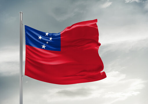 Samoa national flag cloth fabric waving on beautiful sky Background.