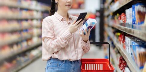 Web banner of modern shopping. Close up of caucasian woman scans qr code of product using...