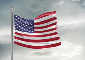 United States national flag cloth fabric waving on beautiful sky Background.