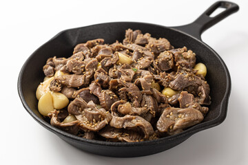 Stir-fried chicken gizzards and garlic on a white background