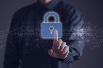 businessman holds a lock icon hologram as the symbol of online data and information security