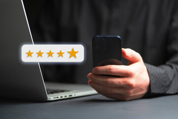 person giving a five star rating online holding a smartphone, customer review concept