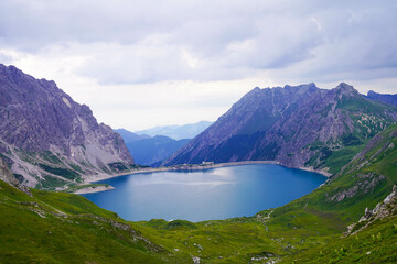 Emerald green Lünersee surrounded by majestic mountains in Austria