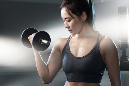 Young woman weight training