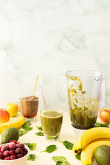 Healthy breakfast ,healthy tasty smoothies with frozen strawberries, cherries and bananas and avocado, pea protein and mixed greens, spinach and broccoli, smoothie jar mixer