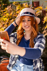 Cheerful Young Woman Fashionably Enjoying Autumn
