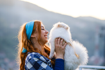 Young Woman Smiling with Her Long-Haired Pet