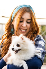 Young Woman Smiling with Her Long-Haired Pet