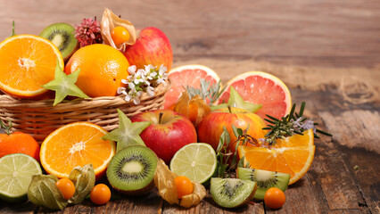 assorted of fresh fruits- orange, grapefruit, apple and kiwi