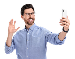 Smiling man taking selfie with smartphone on white background