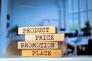 Wooden blocks with words 'product price promotion place'. Business concept