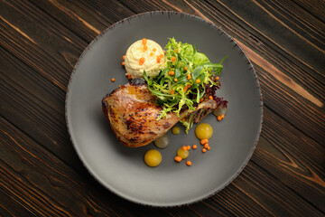Delectable pan-seared duck leg with healthy vegetable medley