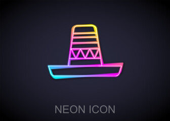 Fototapeta na wymiar Glowing neon line Traditional mexican sombrero hat icon isolated on black background. Vector