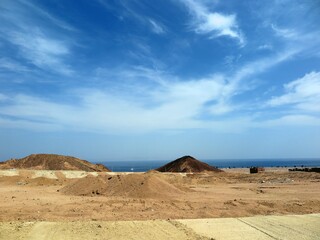 Mountains, against sky and sea 