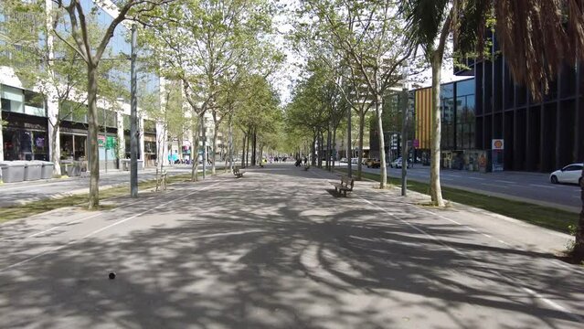Walking in El Poblenou neighborhood in Barcelona on a beautiful Spring day