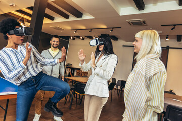 Business people making team training exercise during team building seminar using VR glasses