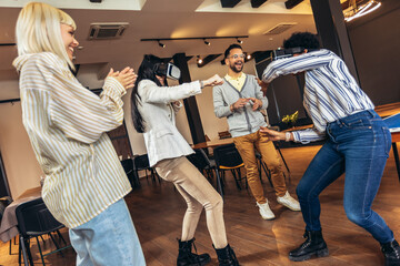 Business people making team training exercise during team building seminar using VR glasses