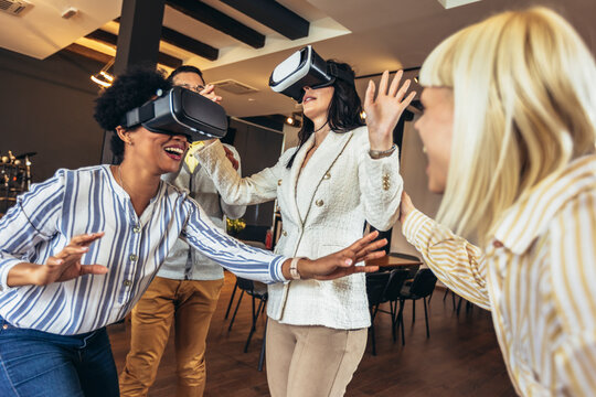 Business people making team training exercise during team building seminar using VR glasses