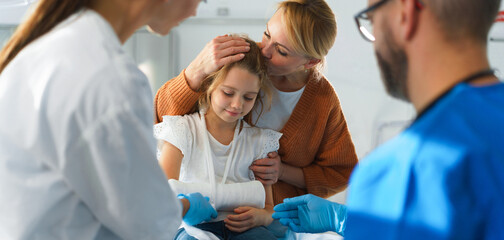 Little girl with her mother in surgery examination.