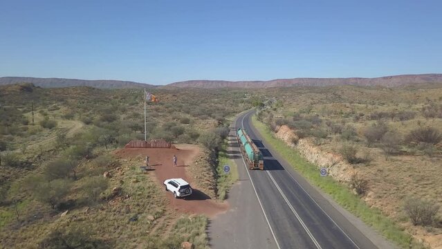 Aerial view of a rural highway with a passing industrial truck
