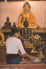 Songkran day with women in traditional Thai dress.