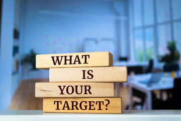 Wooden blocks with words 'WHAT IS YOUR TARGET?'. Business concept