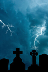 cemetery crosses and dramatic stormy sky above