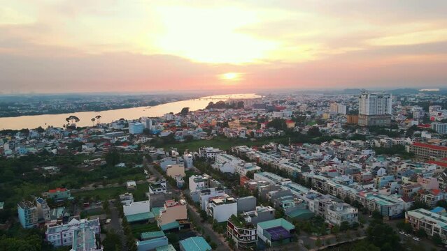 Aerial drone footage of the city and the sea at sunset in Vietnam