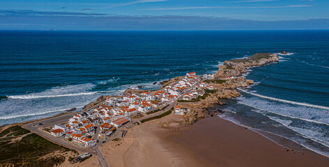 Fototapeta premium Aerial view of island Baleal near Peniche on shore of ocean west coast of Portugal with sandy beach