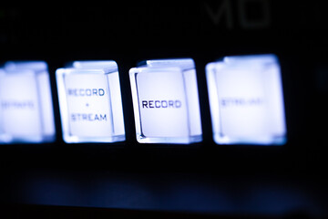 Audio and video production switcher of television broadcast, buttons on black background