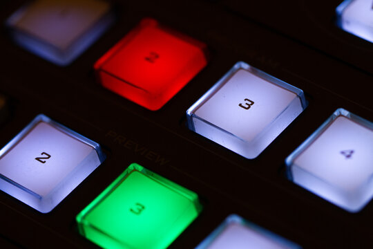 Audio and video production switcher of television broadcast, buttons on black background