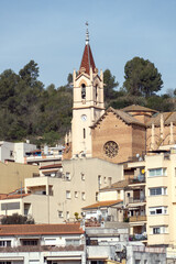 Fototapeta na wymiar A church of an urban nucleus stands out, located in the town of Torelló del Llobregat