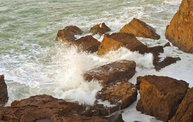 waves breaking on rocks