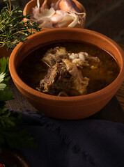 Beautiful shot of a bowl of a soup with pork