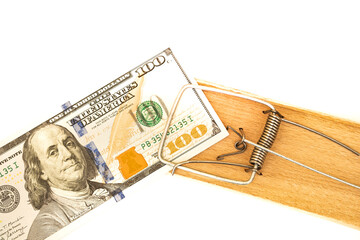 Many banknotes in mouse trap on the white background