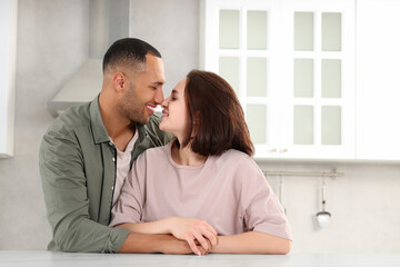 Dating agency. Happy couple spending time together in kitchen, space for text