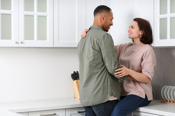 Dating agency. Happy couple spending time together in kitchen, space for text