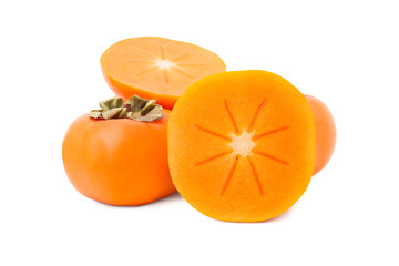 Whole and cut delicious ripe juicy persimmons on white background