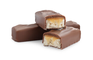 Pieces of chocolate bars with caramel on white background