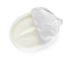 Container with tasty cream cheese isolated on white, top view