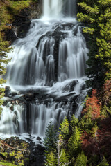 Fototapeta na wymiar Vertical long exposure of Undine Falls on Lava Creek in Yellowstone National Park, Montana, USA